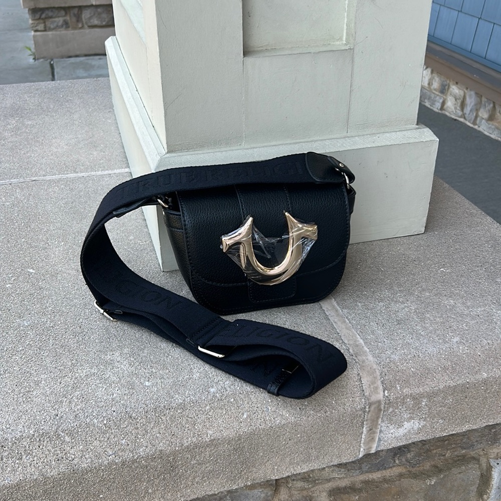 EUC True religion Woman’s mini bag.